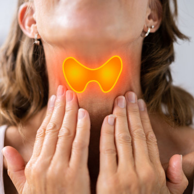 Woman with throat pain